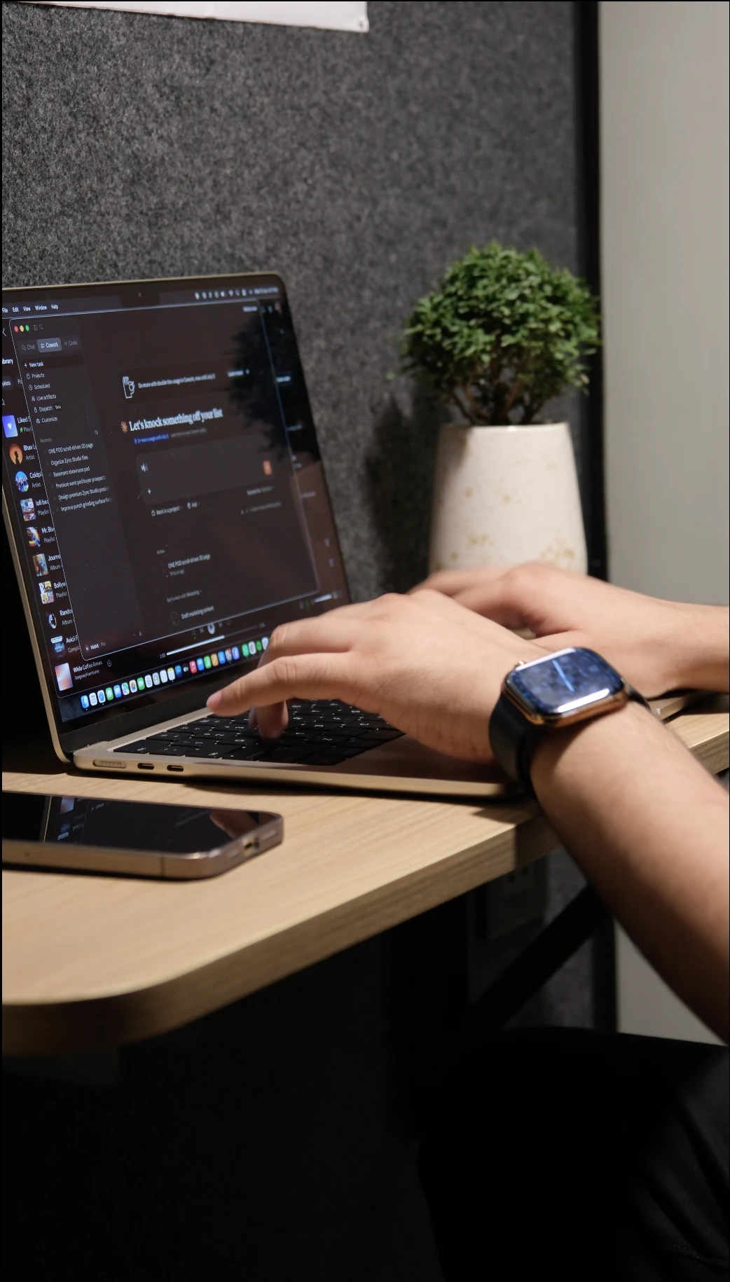 MacBook and Apple Watch at the desk